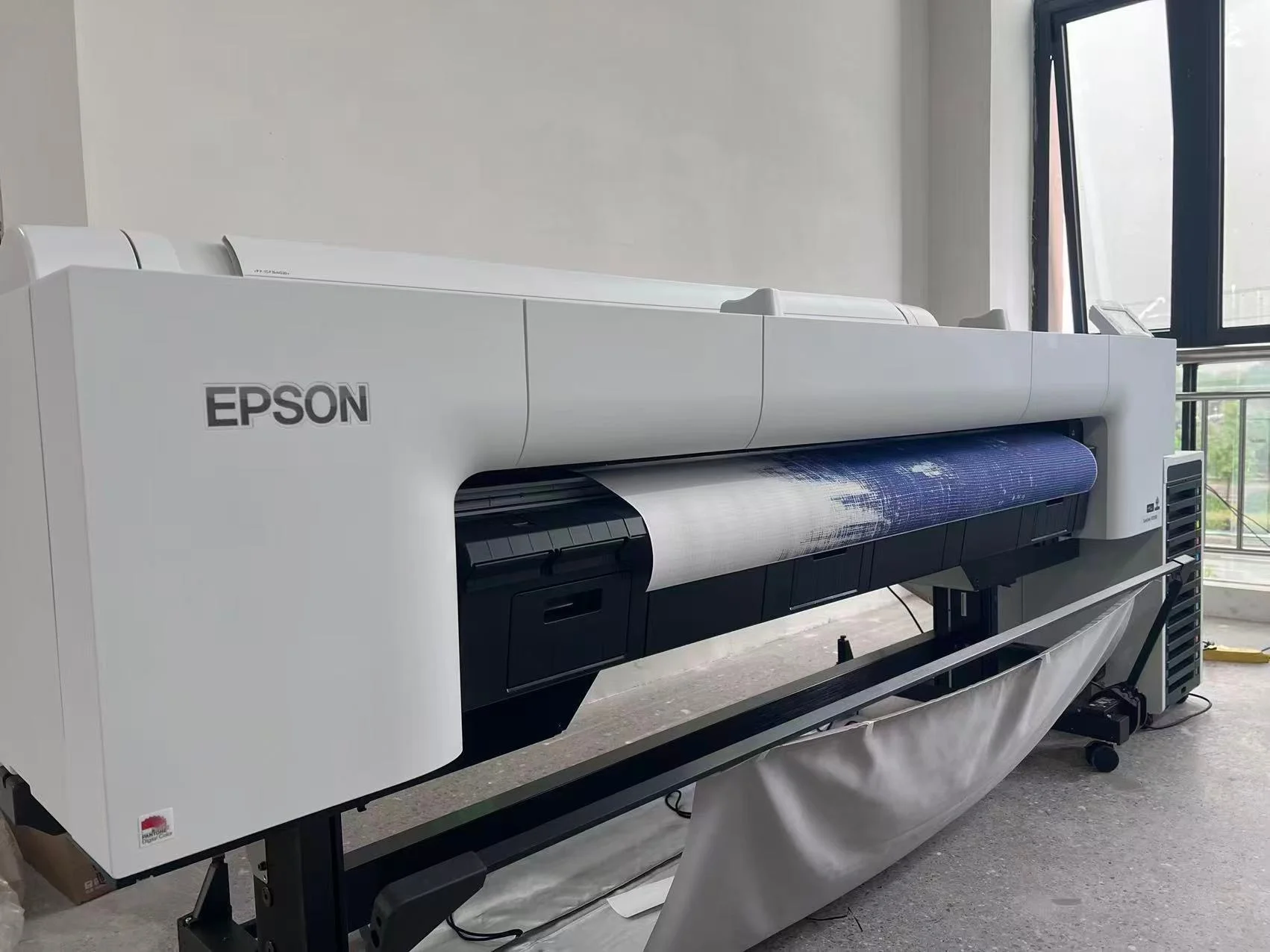 Epson wide-format printer running canvas artwork at the ChinaWallArt factory