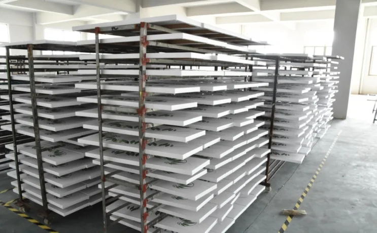 Printed wall art panels curing on factory drying racks