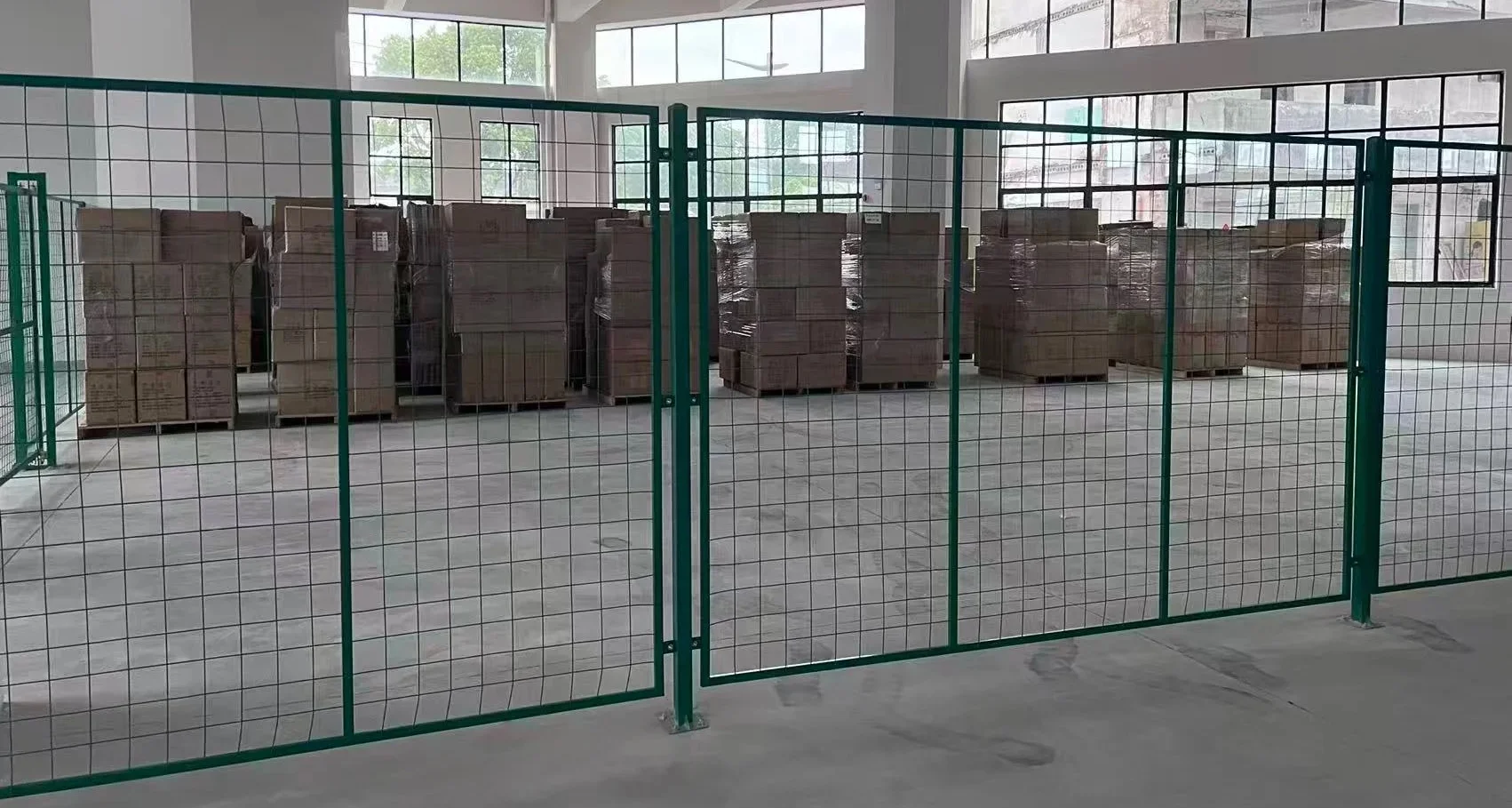 Palletized wall art cartons in the finished-goods warehouse