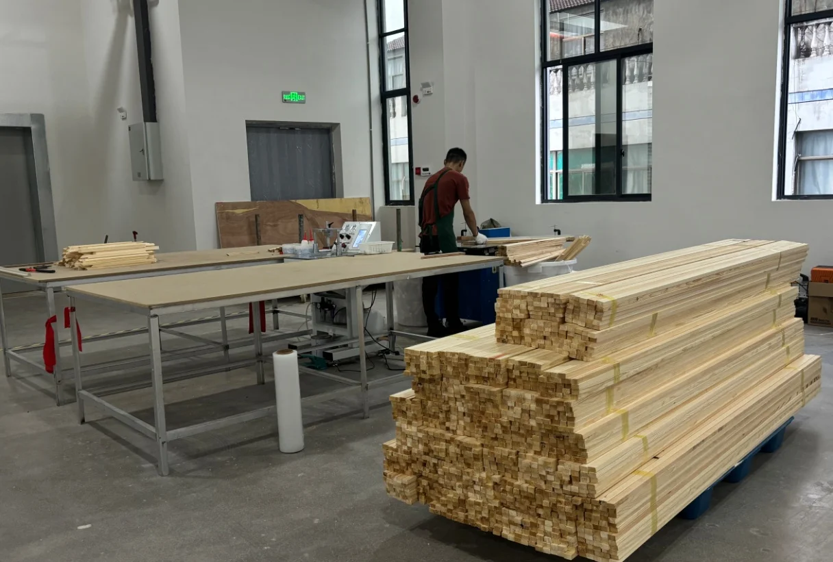 A worker preparing pine frame and stretcher stock